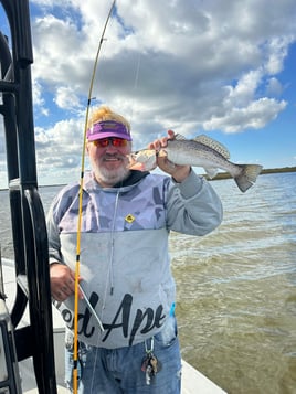 “Marsh Treasures: Redfish, Trout, and Bayou Thrills”  Sport