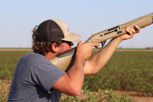 Dove hunter in Texas with shotgun