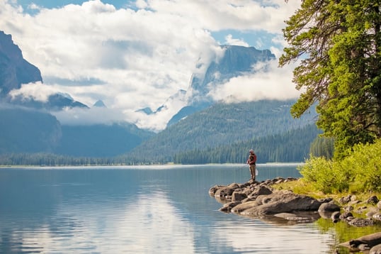 Photo of angler fishing on bank of lake in Wyoming, USA