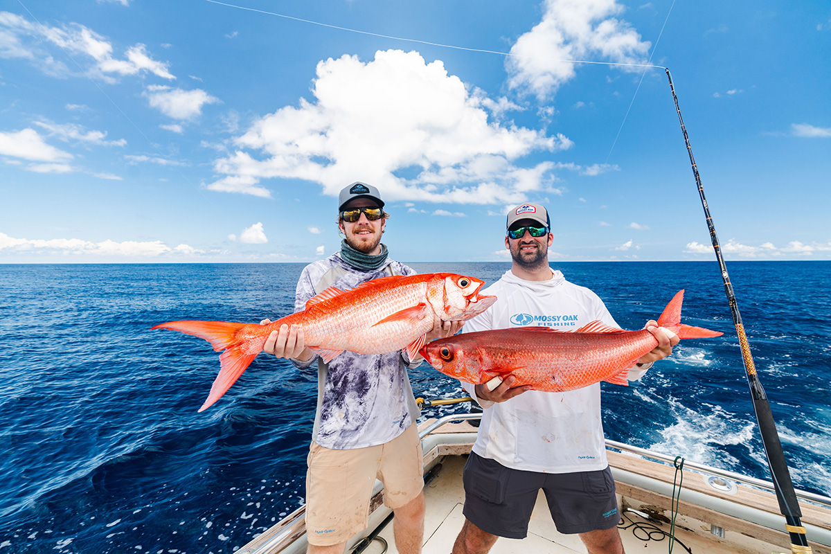 captain experiences founders attison and jonathan holding queen snapper
